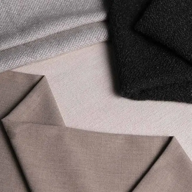 Sunproof Avant Garde acrylic outdoor fabrics in beige, taupe and black bouclé