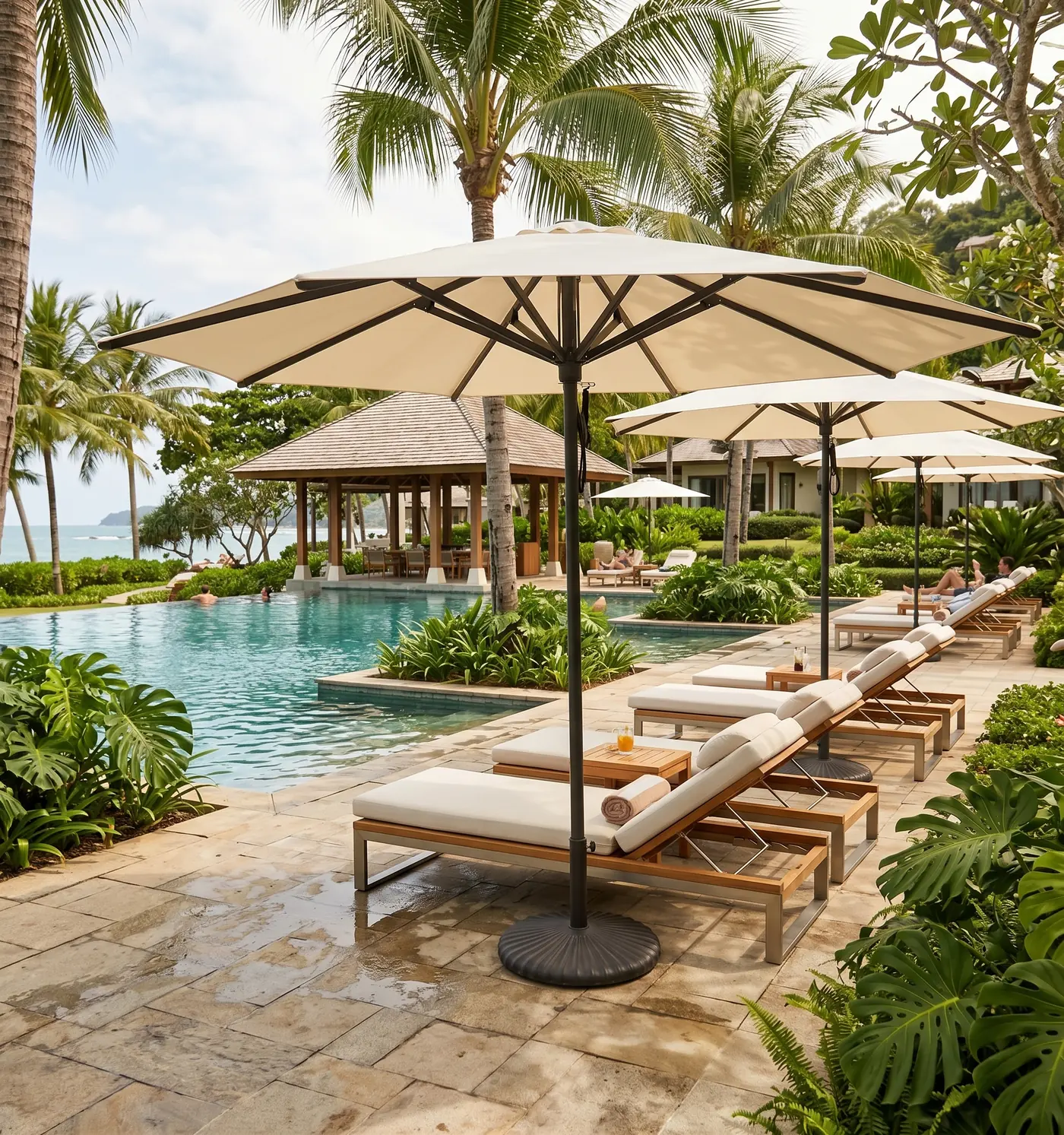Heavy duty umbrellas beside loungers at a 5-star resort pool in Malaysia