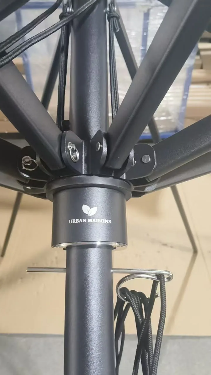 Urban Maisons logo on the hub of a heavy duty umbrella in Malaysia