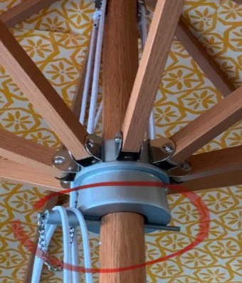 Typical market umbrella hardware with lightweight runner and basic fittings